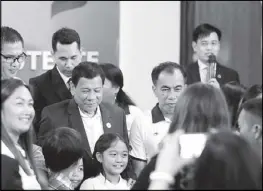  ??  ?? President Duterte meets with the Filipino community in Vietnam on Thursday night.