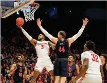  ?? DAVID JABLONSKI / STAFF ?? Dayton’s Trey Landers scores against Duquesne on Saturday at UD Arena. The Flyers won, 80-70.