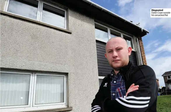  ??  ?? Disgusted
Dylan Cope outside his ransacked flat