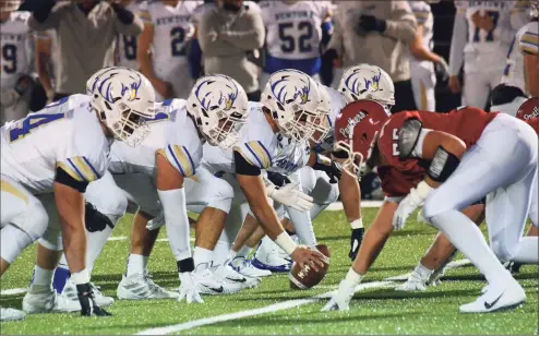  ?? Christian Abraham / Hearst Connecticu­t Media ?? The Newtown offensive line gets into position against Masuk during a 2019 game Monroe.