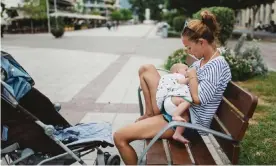  ?? Photograph: Thanasis Zovoilis/Getty ?? A woman feeding her child. (Posed by models.)