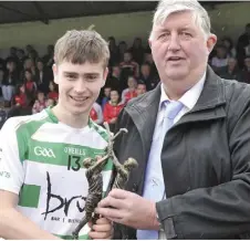  ??  ?? Michael Ryan receives the man-of-the-match award from Seamus Keenan of Anchor Tours