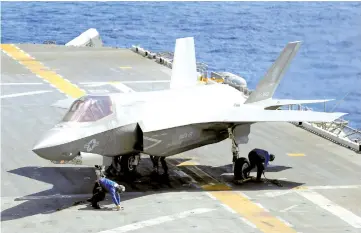  ?? — Reuters photo ?? File photo shows a Lockheed Martin F-35B stealth fighter is seen on the USS Wasp (LHD 1) amphibious assault carrier during their operation in the waters off Japan’s southernmo­st island of Okinawa.