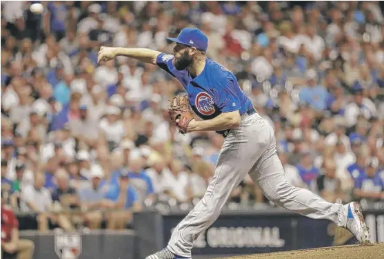  ??  ?? Cubs right- hander Jake Arrieta allowed one run and five hits, struck out two and walked one in five innings in his return from a hamstring injury Thursday. | MORRY GASH/ AP