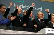  ?? (AP) ?? Tech giant Hewlett Packard Enterprise President & CEO Antonio Neri (right) rings the New York Stock Exchange opening bell on Oct. 24, 2018. Hewlett Packard Enterprise moved its global headquarte­rs to Spring, Texas from California in 2020.