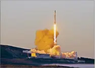  ?? AP PHOTO BY MATT HARTMAN ?? A Falcon 9 rocket lifts off from Vandenberg Air Force Base on Friday, March 30. The satellites are expected to be deployed into low Earth orbit about an hour after liftoff.