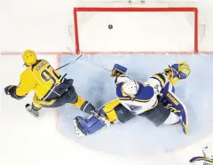  ?? AP ?? Predators centre Ryan Johansen, No.92, scores the winning goal against the Blues.