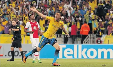  ?? / PETRI OESCHGER/GALLO IMAGES ?? Ricardo Nascimento of Mamelodi Sundowns celebrates after converting a penalty against Ajax Cape Town last night. Downs won 2-1.