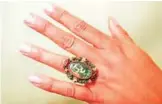  ?? — AFP photos ?? A model poses with an oval shaped ring designed by Pablo Picasso, during a photocall at Sotheby's auction house in London.