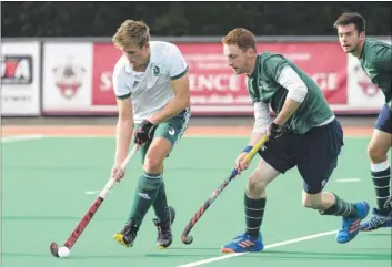  ?? Picture: Andy Payton FM4974011 ?? Sam Barrett of Canterbury 2nds (white) takes on the Surbiton defence during Saturday’s 3-0 win at Polo Farm