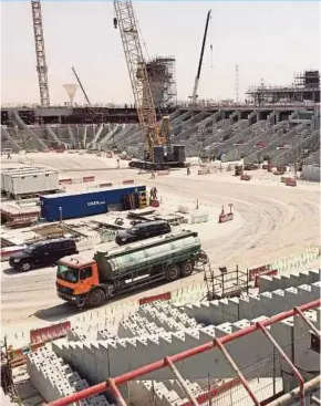  ?? BLOOMBERG PIC ?? Qatar wants to build at least eight stadiums, lay dozens of miles of rail work and erect a brand new city before the world’s mostwatche­d sporting event in 2022.