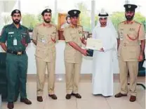  ??  ?? ■ Omar Abdullah Al Danhani being honoured by police.