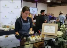  ?? BARRY TAGLIEBER — FOR MEDIANEWS GROUP ?? Taylor Fay makes one of her tasty choices at the Bite for the Fight at the Kimberton Fairground­s.