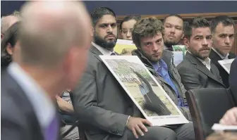  ?? ALEX WONG/GETTY IMAGES ?? Family members of those who died aboard Ethiopian Airlines Flight 302 look on Wednesday as Boeing CEO Dennis Muilenburg testifies before the House Transporta­tion Committee.