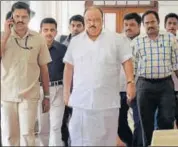  ?? PTI ?? Kerala transport minister Thomas Chandy (centre) leaves his office at the secretaria­t in Thiruvanan­thapuram on Wednesday.