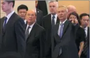  ?? ANDY WONG — THE ASSOCIATED PRESS ?? U.S. Commerce Secretary Wilbur Ross, second from left, and Chinese Vice Premier Liu He, right, arrive to attend a meeting at the Diaoyutai State Guesthouse in Beijing, Sunday. U.S. Commerce Secretary Ross is in Beijing for talks on China’s promise to...