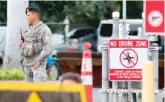  ?? CALEB JONES/AP ?? Security forces stand guard outside Joint Base Pearl Harbor-Hickam in Hawaii on Wednesday.
