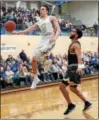  ?? TIM PHILLIS — THE NEWS-HERALD ?? John Carroll’s Jimmy Berger drives to the basket against Baldwin Wallace on Feb. 22.