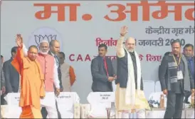  ?? AP ?? Uttar Pradesh chief minister Yogi Adityanath and Union home minister Amit Shah during a pro-caa rally n in Lucknow on Tuesday.