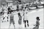  ?? MARK HUMPHREY ENTERPRISE-LEADER ?? Farmington sophomore Makenna Vanzant launches a short-range jumper over a trio of 6-feet Providence Academy defenders on Jan. 30. Vanzant scored 10 points in the Lady Cardinals’ 36-34 road loss at Alma Feb. 9.