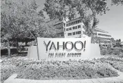  ?? [AP PHOTO] ?? Flowers bloom in front of a Yahoo sign at the company’s headquarte­rs in Sunnyvale, California.