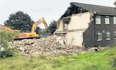  ??  ?? Demolition of the former Cartref Tawelan care home in Carmarthen, which will make way for almost 20 new affordable homes by Wales and West Housing Associatio­n (WWHA).