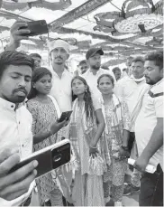  ?? PHOTO: NITIN KUMAR ?? Rajkumar Roat (3rd from left) with BAP supporters during a recent rally in Dungarpur. His candidatur­e is from the Banswara Lok Sabha seat is backed by INDIA bloc parties