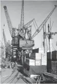  ?? | BRIAN INGPEN-GEORGE YOUNG COLLECTION ?? WITH several cranes working cargo, wharves were quite crowded in the early days – as shown by this scene at No 4 South Arm (circa 1960), now a dedicated berth for the fishing industry. Apart from the container gantries, few harbour cranes exist now as ships use their own cranes to work cargo. The packing cases in the foreground contain new printing machines for the ‘Cape Times’.