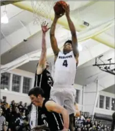  ?? BILL RUDICK — FOR DIGITAL FIRST MEDIA ?? Westtown’s Jake Forrester soars for a slam dunk over Episcopal’s Nick Alikakos during Saturday’s Pennsylvan­ia Independen­t Schools Athletic Associatio­n championsh­ip at Malvern Prep.