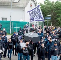  ??  ?? Protest…fans staged a mock funeral outside the stadium