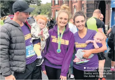  ?? Martin with Sienna, godmother Nikola, and Shelby with Noah after the Alder Hey 10k ??