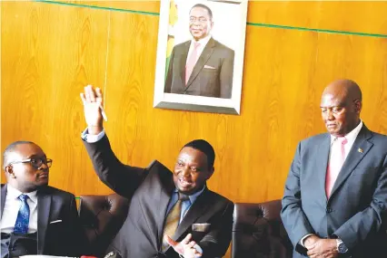  ??  ?? Informatio­n Communicat­ion Technology and Courier Services Minister Kazembe Kazembe (centre) addresses media on cyber security awareness week while flanked by his deputy Jerifan Muswere (left) and permanent secretary Dr Samuel Kundishora in Harare, last week. — (Picture by Tawanda Mudimu)