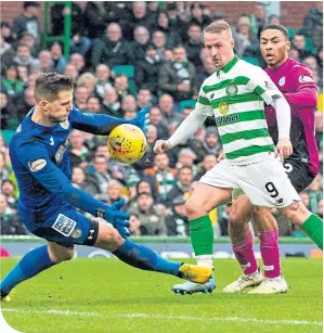  ??  ?? Leigh Griffiths scores his second goal on the way to his hat-trick