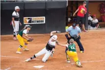  ?? Staff photo Joshua Boucher ?? Hughes Springs’ Haylee Wilson is safe at home after Little River Academy’s Destini Hulsey drops the ball Wednesday at the Red and Charline McCombs Field in Austin. Hughes Springs lost, 2-3.