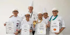  ??  ?? (From left) Berjaya UCH students Ang Wei Ming, Mong Zhi Ling, Chong Suet Nie and Ng Wei Xian were pleased to show their medals and certificat­es received at HOFEX, together with Global Master Chef Jochen Kern, director Faculty of Culinary Arts and Chef...