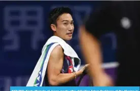  ?? — AFP ?? NANJING: Kento Momota of Japan reacts after defeating Artem Pochtarov of the Ukraine in their men’s singles match during the badminton World Championsh­ips yesterday.