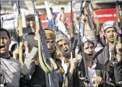  ?? HANI MOHAMMED / ASSOCIATED PRESS ?? Shiite rebels chant slogans as they hold up their weapons during a demonstrat­ion in Sanaa, Yemen, on Thursday against an arms embargo imposed by the U.N. Security Council on Houthi leaders.