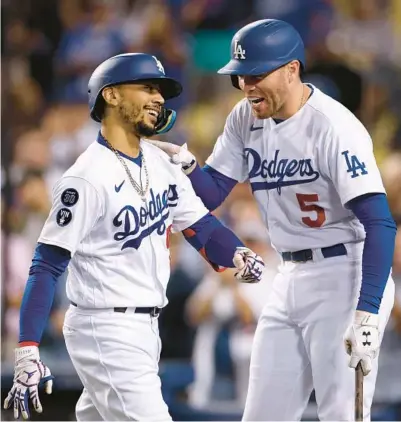  ?? HARRY HOW/GETTY ?? Mookie Betts, Freddie Freeman and the Dodgers are looking formidable as the Major League Baseball playoffs approach.