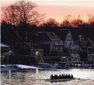  ?? MATT ROURKE/AP ?? A crew sets out on the Schuylkill River on Thursday as lights illuminate the outline of structures on the famous Boathouse Row in Philadelph­ia.