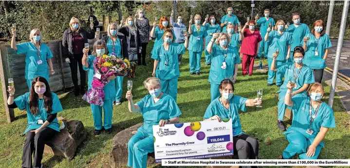  ?? HUW JOHN, CARDIFF 2021 ?? Staff at Morriston Hospital in Swansea celebrate after winning more than £100,000 in the EuroMillio­ns
