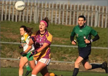  ??  ?? Wexford centre-back Róisín Murphy delivers a handpass during Sunday’s success.