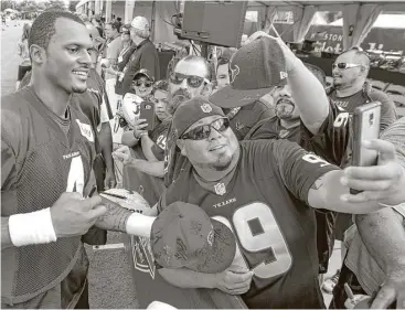  ?? Brett Coomer photos / Houston Chronicle ?? Rookie quarterbac­k Deshaun Watson was a popular figure as Texans fans had the first of two opportunit­ies Monday to attend a preseason practice after the team spent training camp in West Virginia. Tuesday’s practice also is open to the public, with...