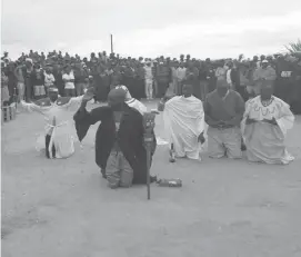  ??  ?? Prophets lead residents in prayer during a cleansing ceremony in Cowdray Park recently