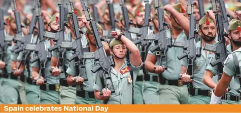  ?? AP ?? Spanish soldiers march during a military parade as the country celebrates its National Day in Madrid, yesterday. Amid tensions over efforts by separatist­s to attain Catalonian independen­ce, the annual public holiday provides a cue for nationwide displays of pomp and patriotism.