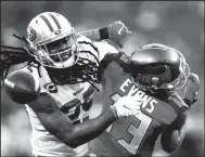  ?? TRIBUNE NEWS SERVICE ?? Tampa Bay Buccaneers wide receiver Mike Evans (13) is unable to come up with the catch as he is covered by San Francisco 49ers cornerback Richard Sherman during a game in 2019.