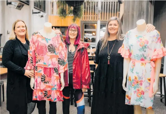  ?? Photo / Tammie Pittwood Photograph­y ?? Pop-up shop event manager Suzanne Wallworth, pop-up shop assistant Sharlene King, and Taranaki Women’s Refuge relationsh­ips manager Shona Smith with some of the clothes ready to go on sale at the event.