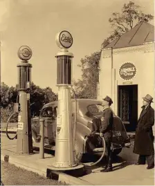  ?? Photo courtesy Exxon Mobil Corp. ?? Humble and Esso brand gasoline were available at a Houston Humble station in 1937.