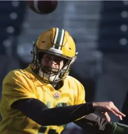  ?? RYAN REMIORZ PHOTOS/THE CANADIAN PRESS ?? Redblacks quarterbac­k Henry Burris, left, and Edmonton’s Mike Reilly will go head-to-head in Sunday’s Grey Cup.