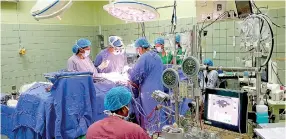  ??  ?? A Coronary Artery Bypass operation at the Cardiothor­acic Operating Theatre in the main building complex of the National Hospital.