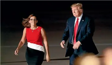  ?? AP ?? President Donald Trump stumping for Senate candidate Martha McSally, left, at a campaign rally last week in the city of Mesa, Arizona.